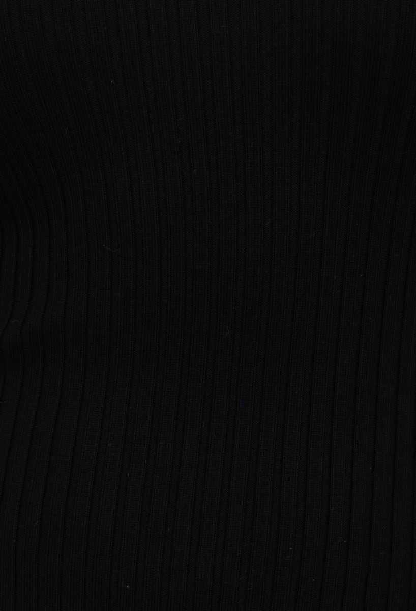 Close-up of the ribbed knit material of the Milton Midi Dress in black, showcasing its stretch and texture.