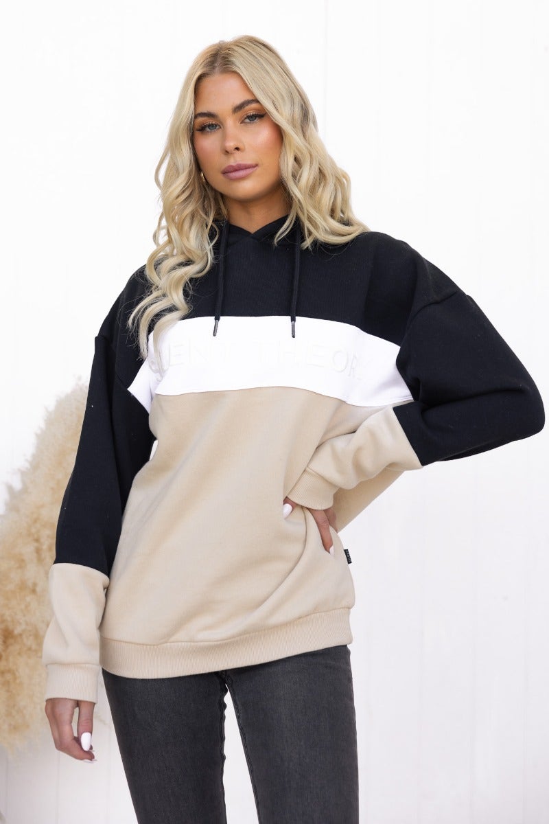 Nayle Jumper in black and beige, featuring a hood, ribbed cuffs, and light fleece lining, styled in an oversized fit.