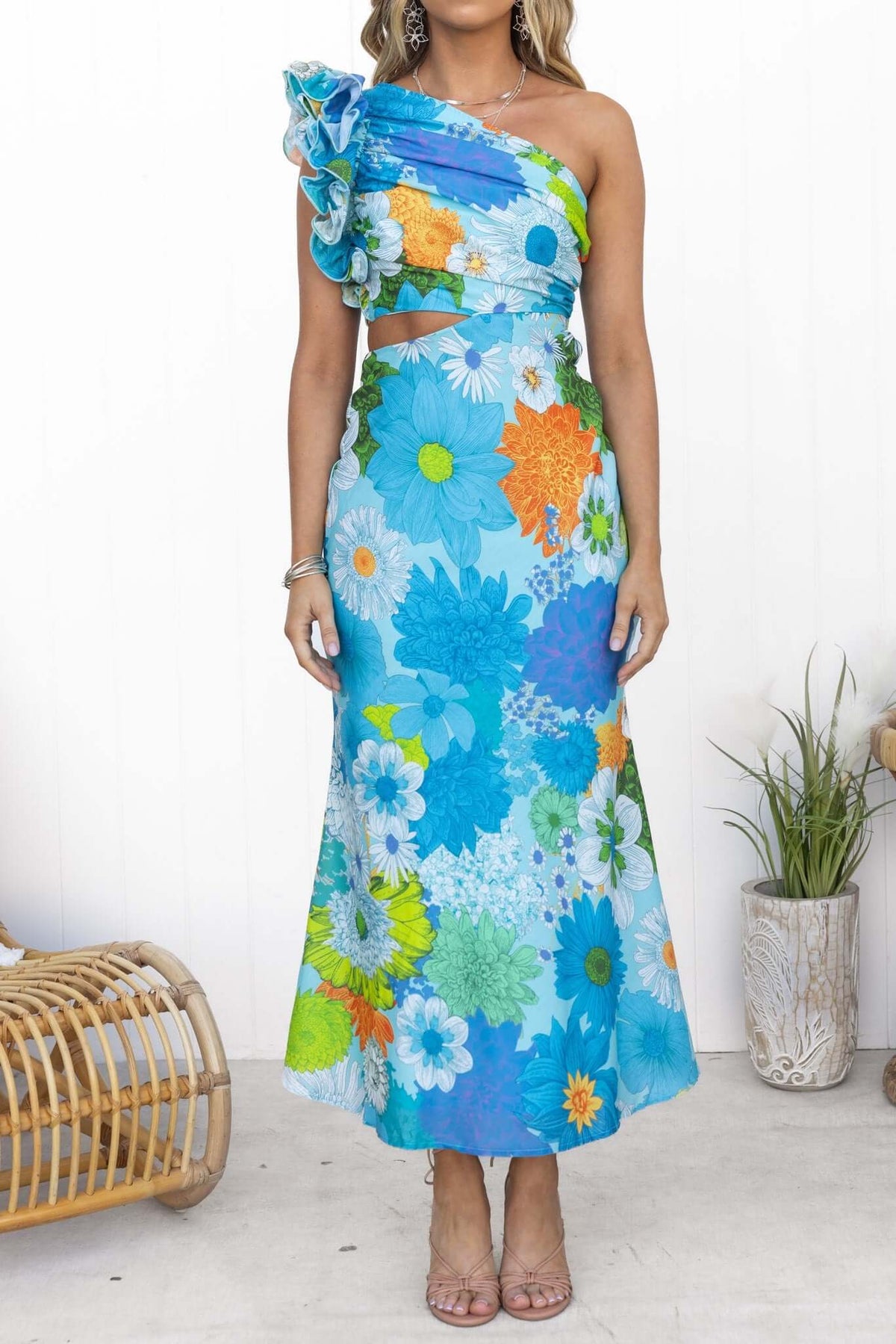 Meriden Maxi Dress featuring a one-shoulder neckline and floral print in vibrant blue and orange hues.