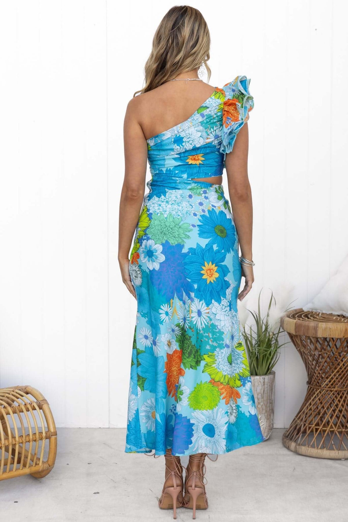 Back view of Meriden Maxi Dress with floral print, one-shoulder design, and a flowing fit.