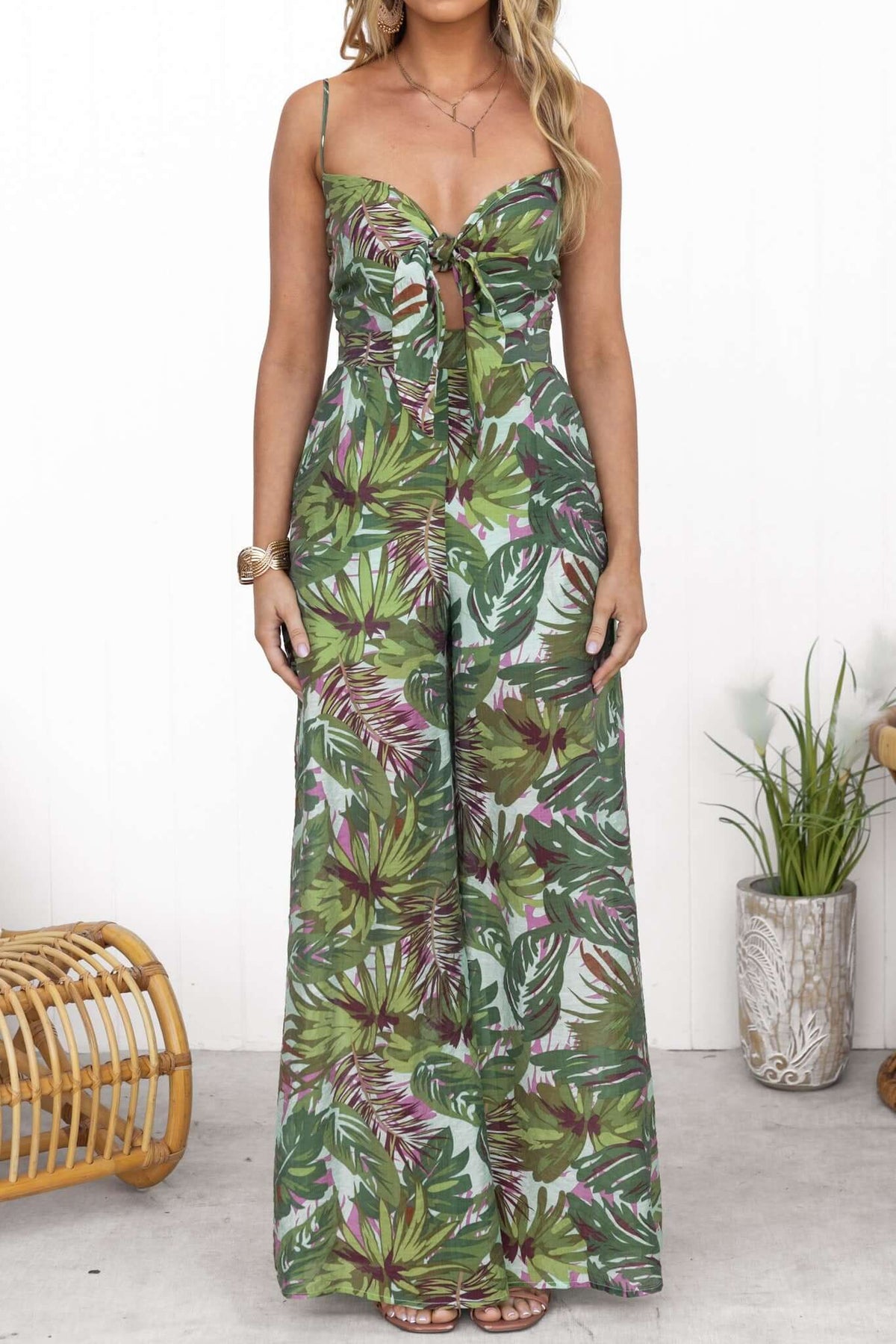 Sun Dazed Jumpsuit with adjustable straps and tie at bust, featuring a vibrant multi-colour tropical print.