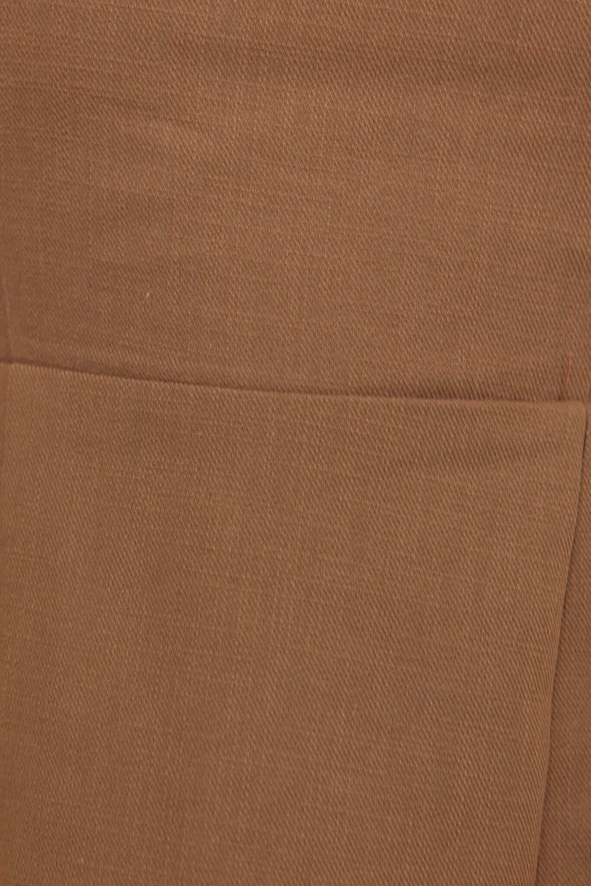 Close-up of Mayfield Dress fabric showcasing soft brown texture and pocket detail, ideal for stylish outfits.