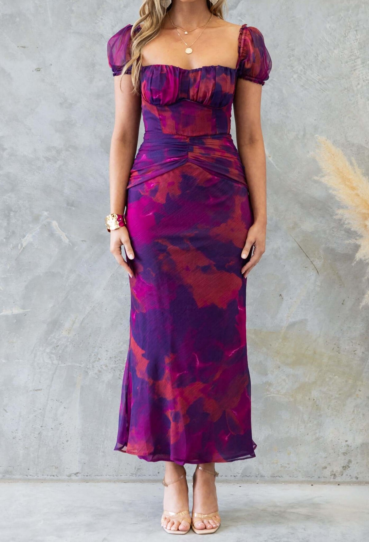 Floral print Qoralee midi dress with elastic sleeves and back, featuring an elegant silhouette and vibrant hues.
