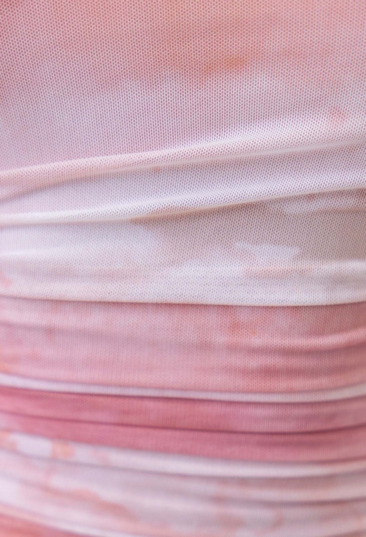 Close-up of Neenah Maxi Dress fabric showing soft pink ruching and textured mesh material.