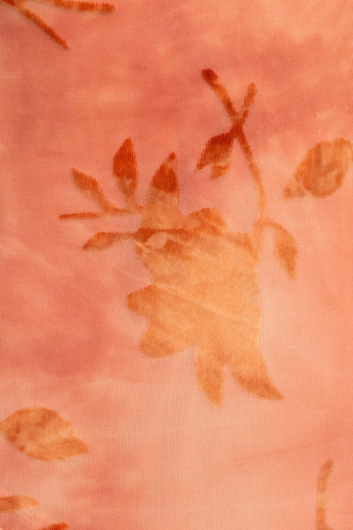 Close-up of a soft, peachy fabric with floral pattern, ideal for the Istelle Maxi Dress.