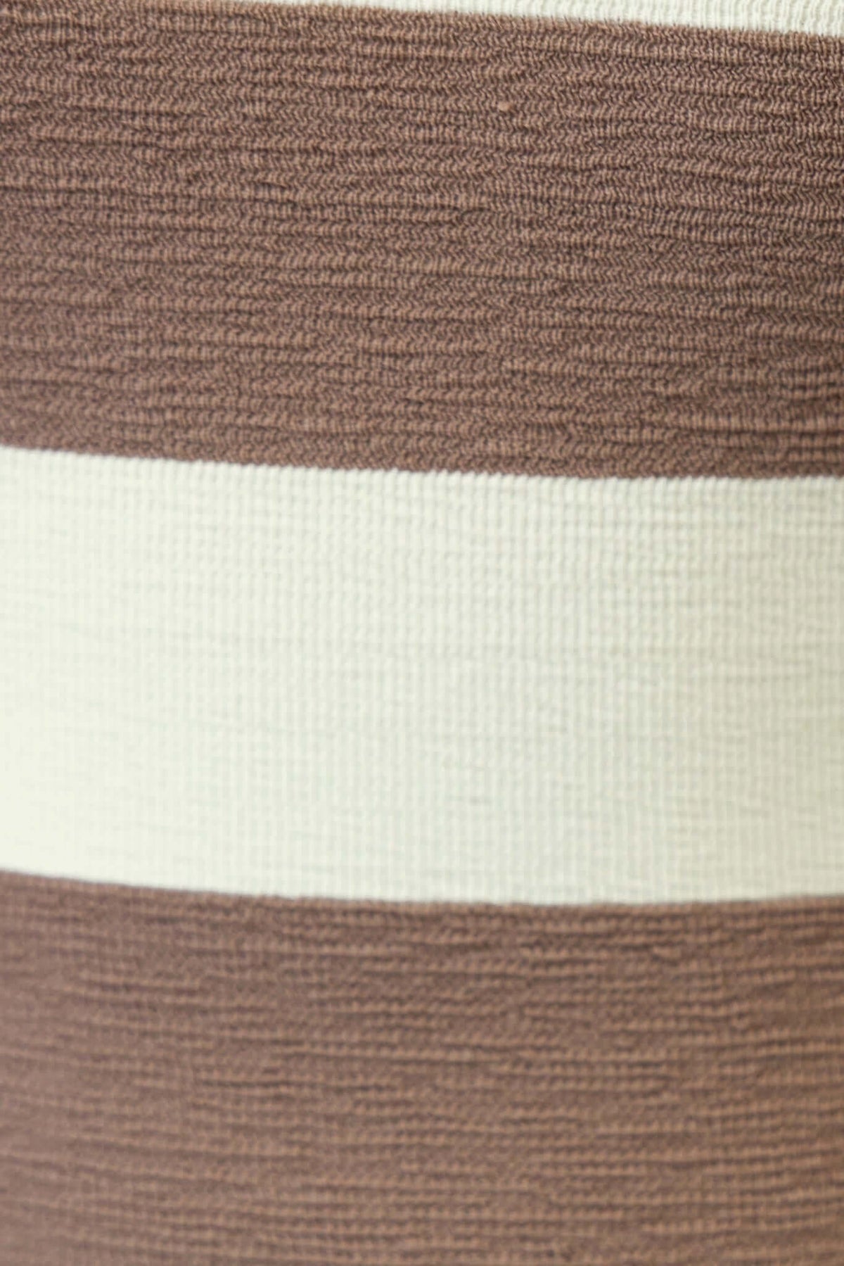 Close-up of textured fabric featuring brown and cream stripes, ideal for a stylish maxi dress.
