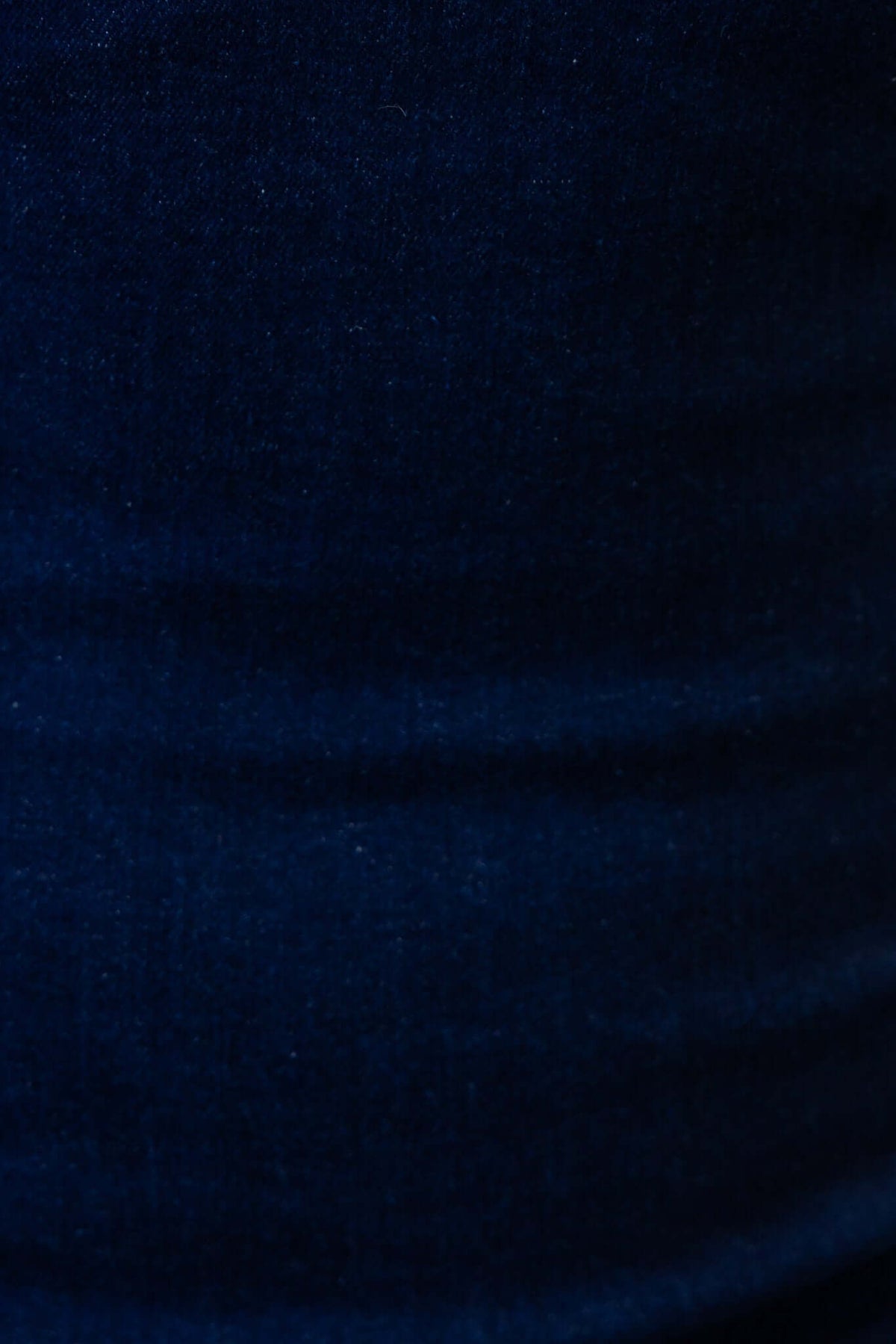 Close-up of soft dark denim fabric showcasing texture, perfect for a stylish maxi dress.