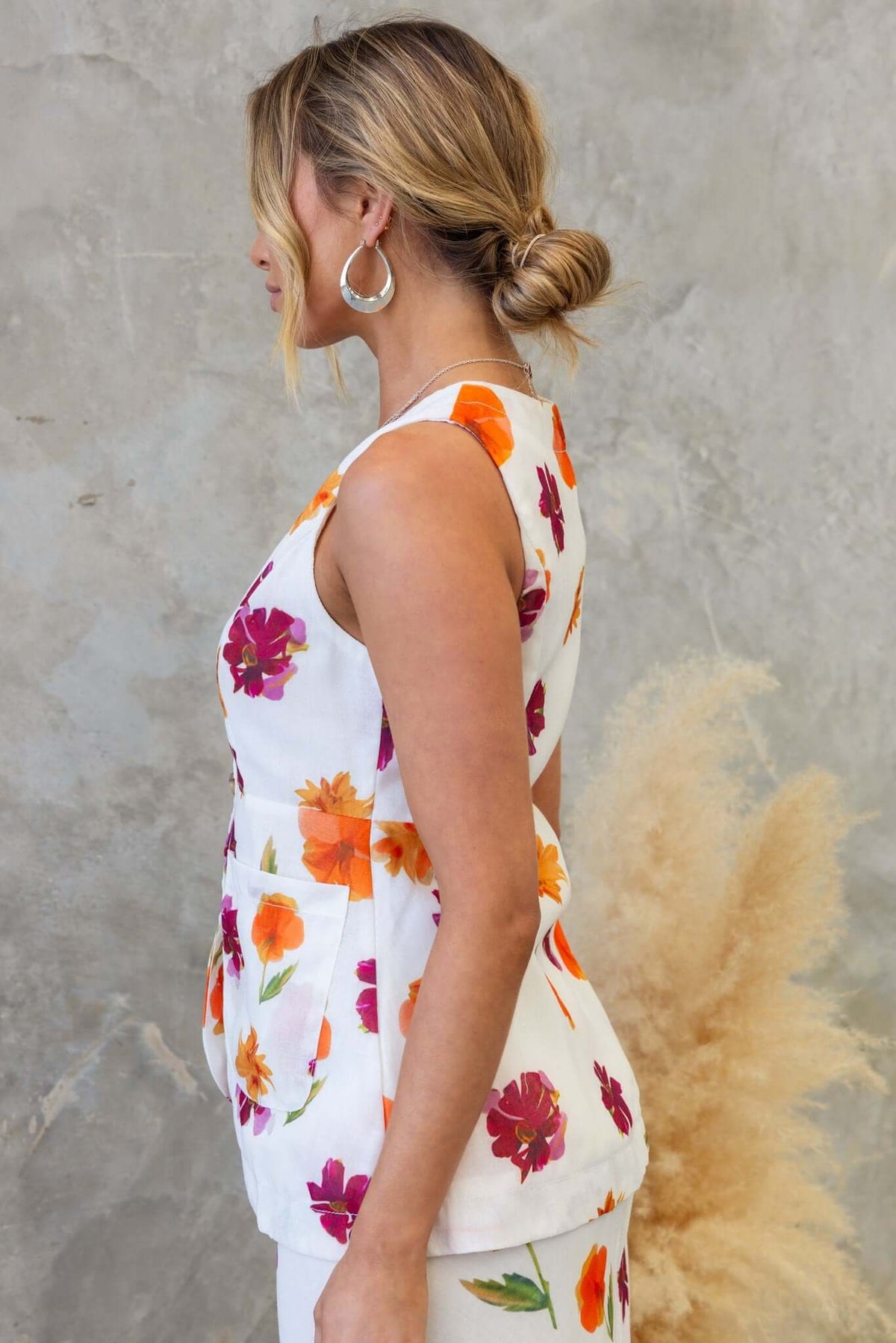 Bexley Top in floral print, showcasing vest style with V-neckline and faux pockets, perfect for a stylish summer look.