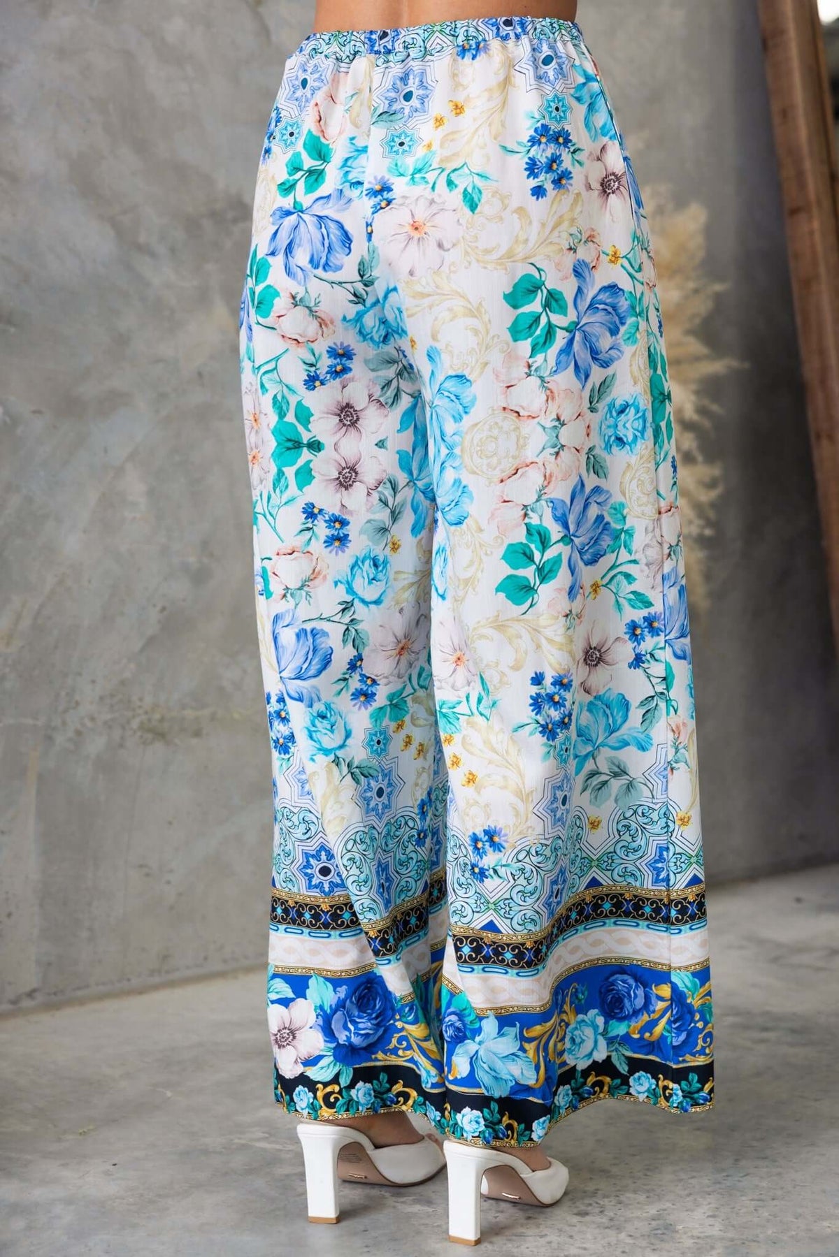 Valora Pants in floral print with elastic waistband and wide legs, showcasing blue and floral patterns, perfect for casual wear.