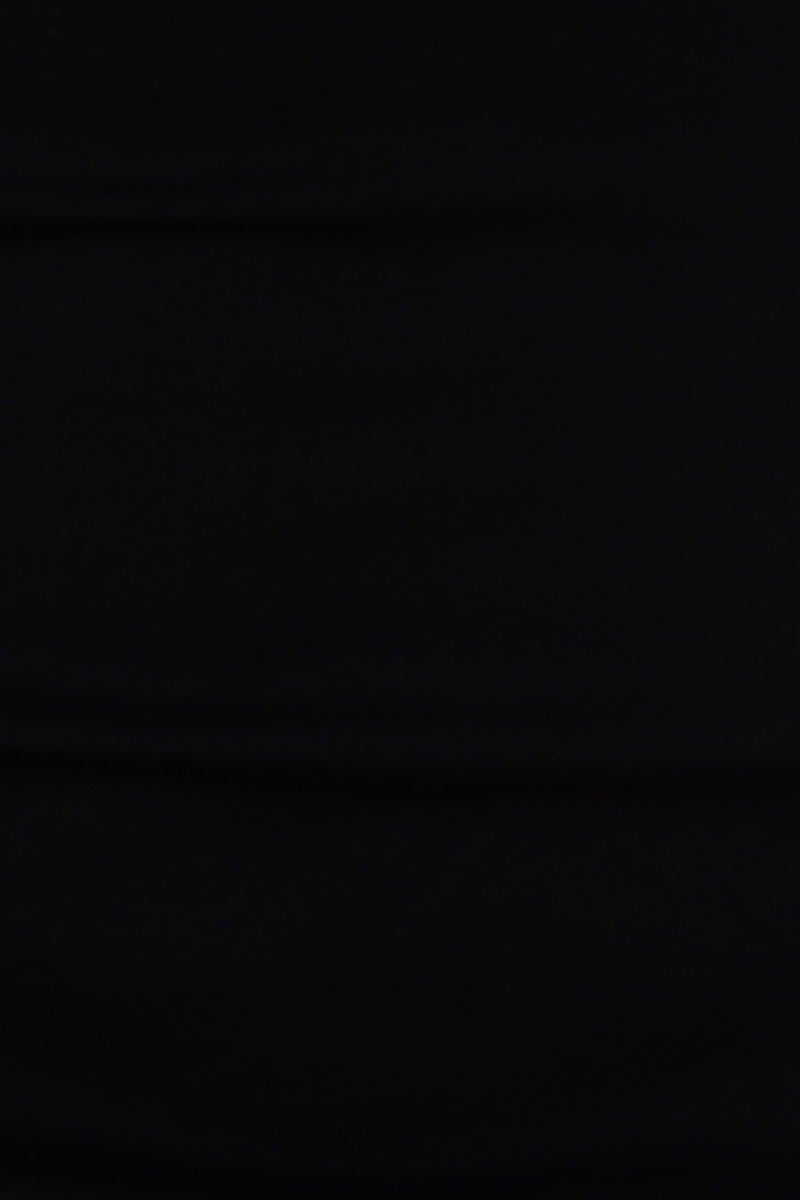 Black bodycon midi dress fabric showing soft structured material with stretch for a comfortable fit.
