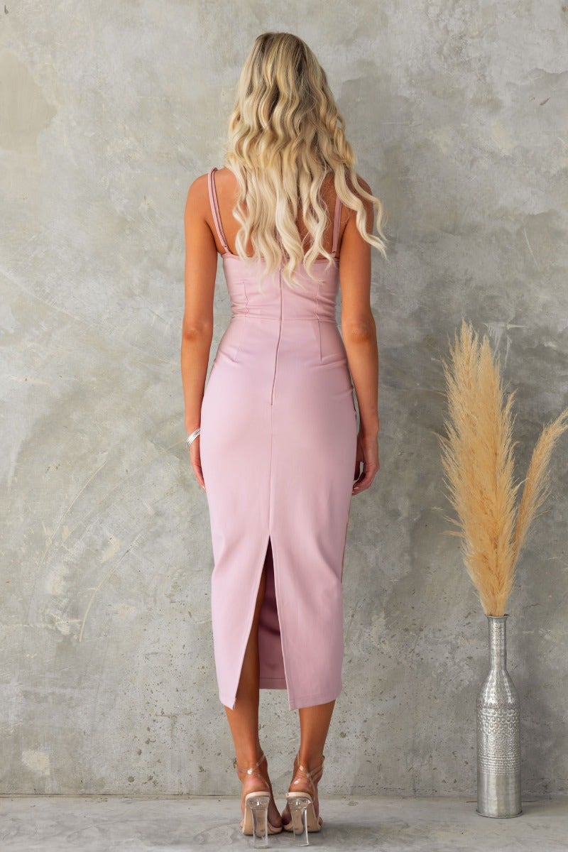 Back view of pink bodycon History Midi Dress with adjustable straps and a back split.