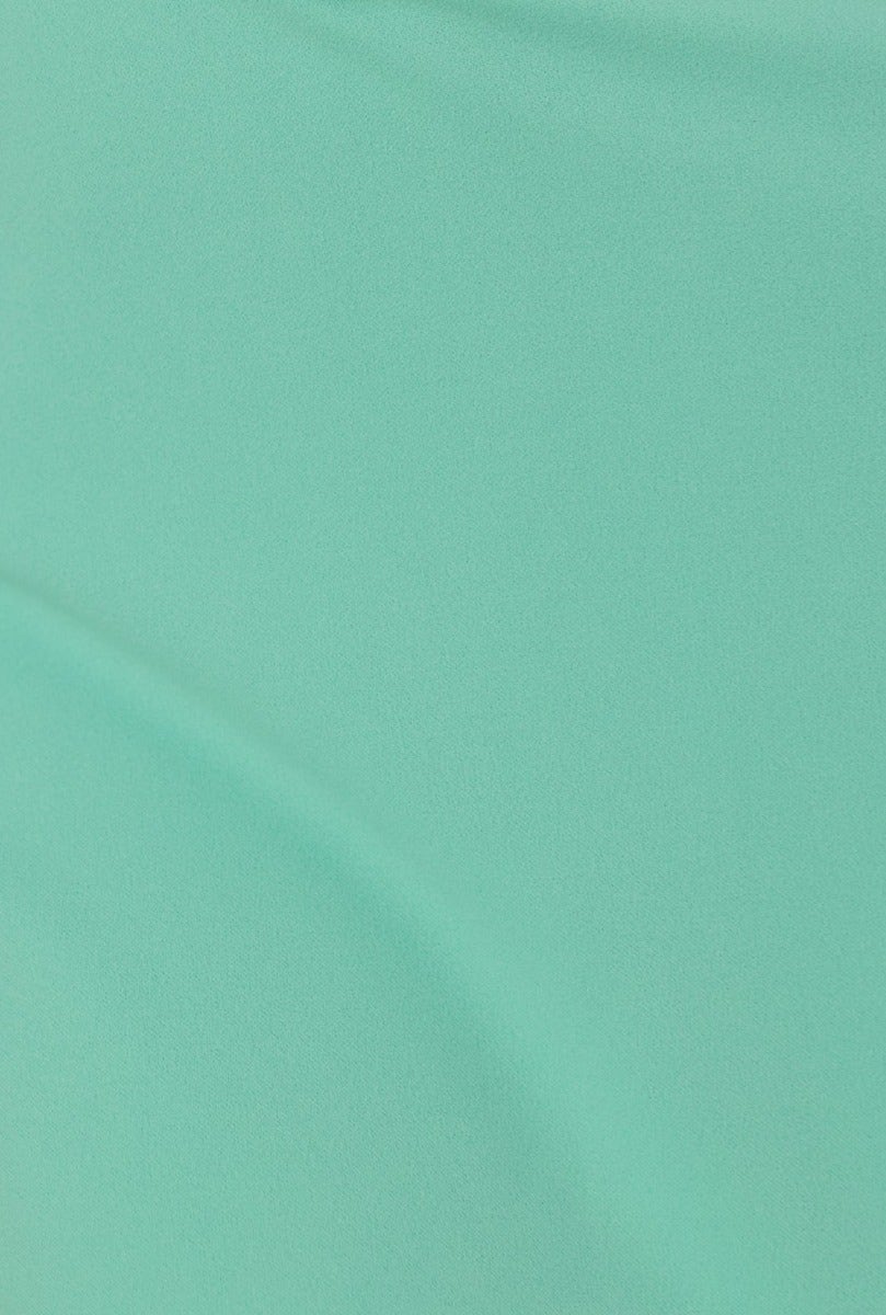 Close-up of smooth mint green fabric, showcasing its soft texture and stretch for the Heads Turn Maxi Dress.