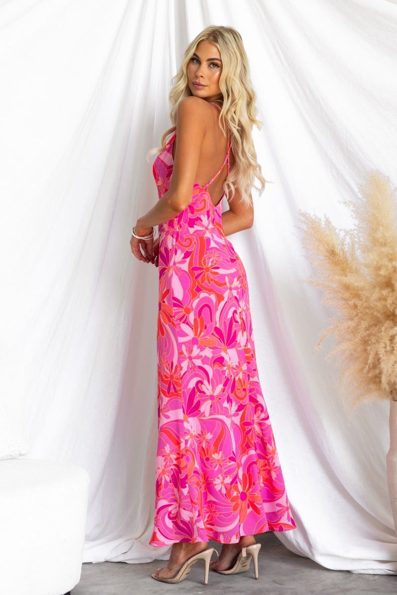 Jemzie Maxi Dress in floral print with V-neckline and adjustable straps, showcased on a model from the back.