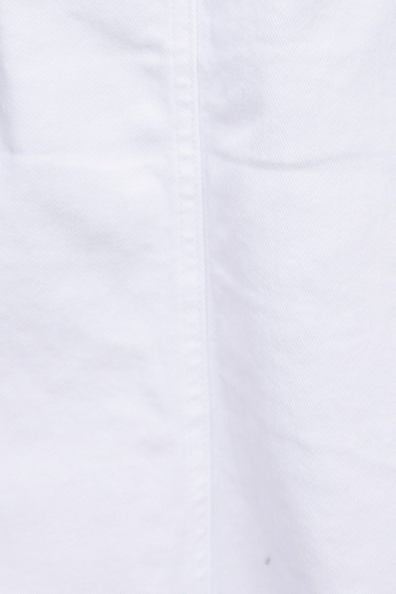 Close-up of white fabric texture showing smooth surface and subtle stitching detail.