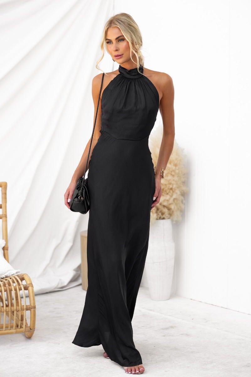 Elegant black Forbidden Love Maxi Dress with high tie neckline, showcasing a slight sheen and lined material.