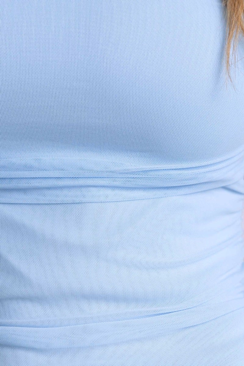 Close-up of the stretch fabric in a light blue Moscato maxi dress with ruching detail.