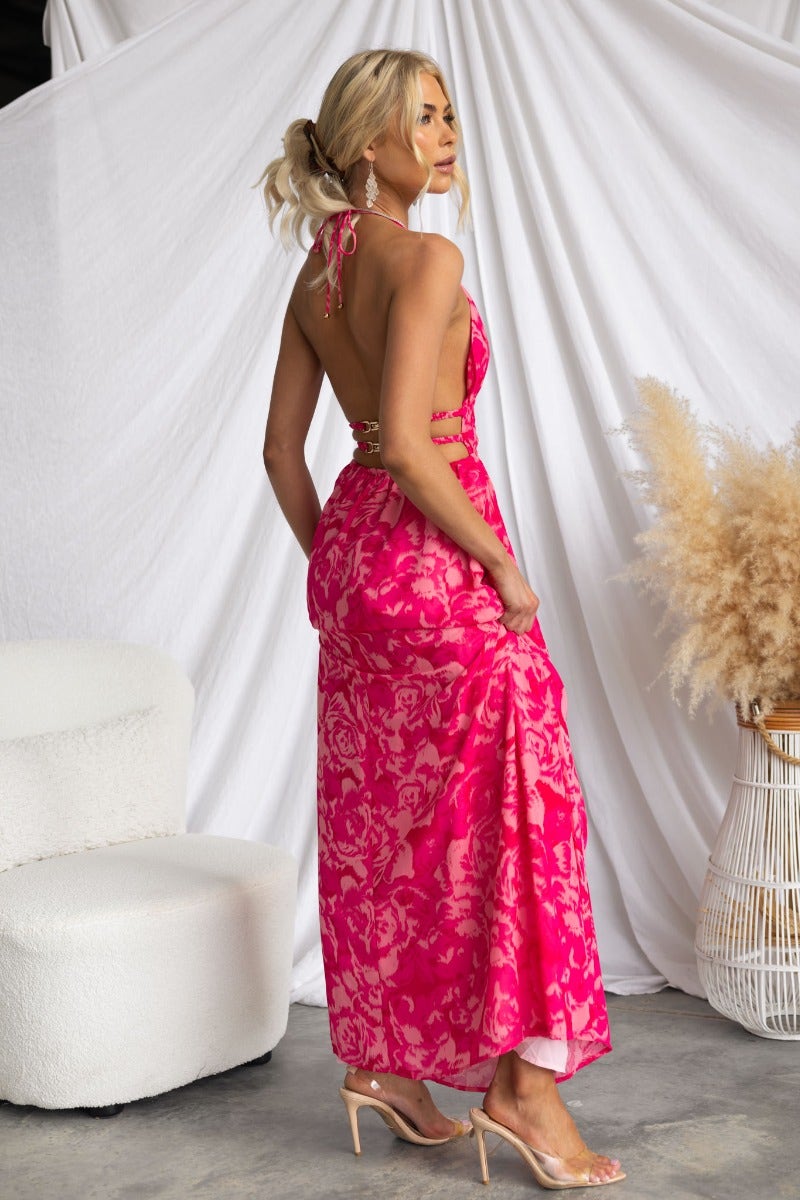 Kariah Maxi Dress in vibrant pink floral design with adjustable tie halter neckline and back clasp closure.