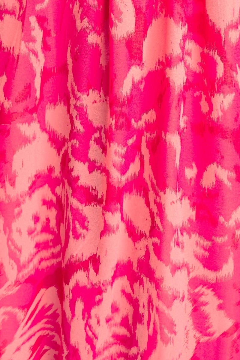 Close-up of the Kariah Maxi Dress featuring a vibrant pink and peach animal print pattern.