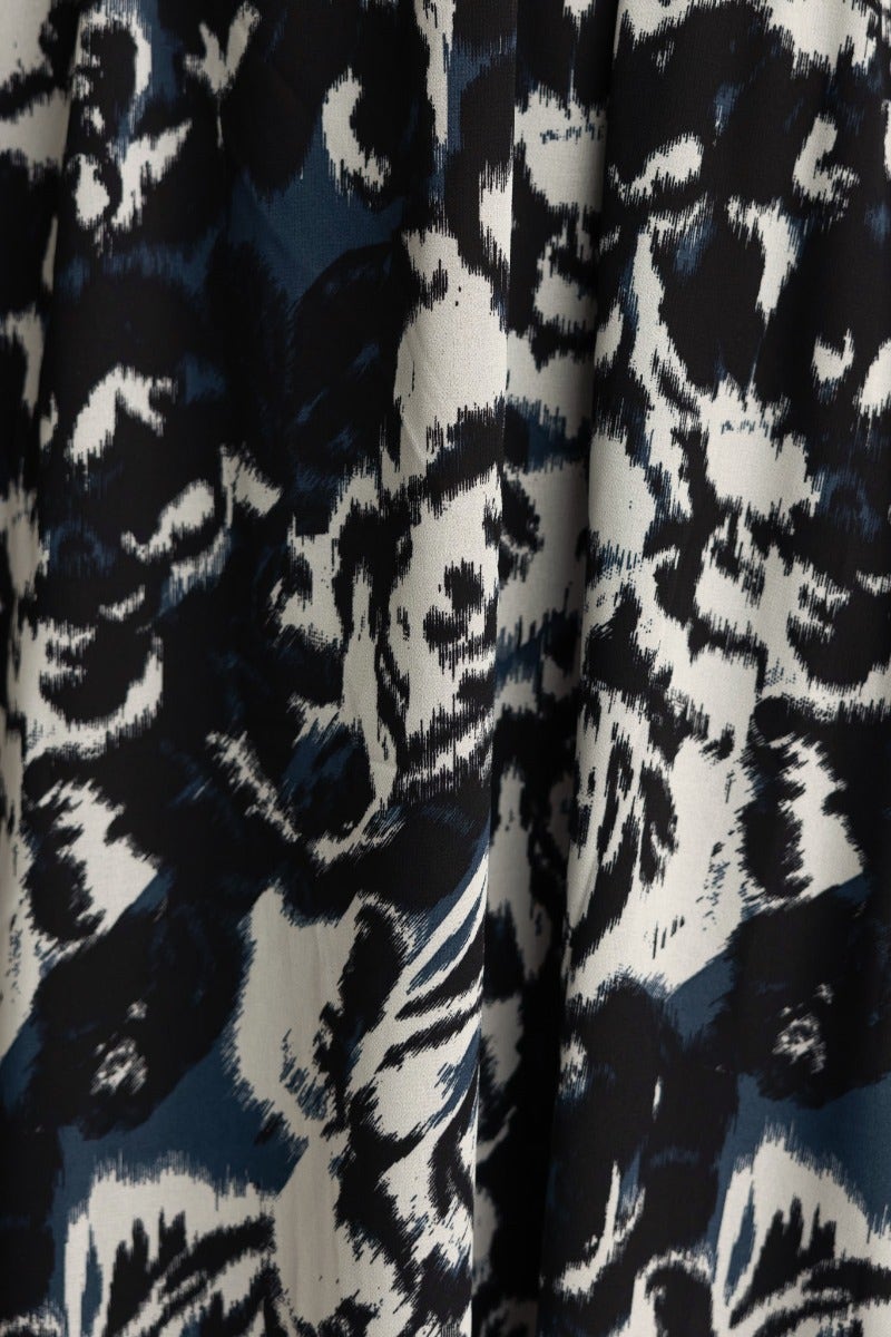 Close-up of black and multi-color floral pattern on Kariah Maxi Dress fabric.