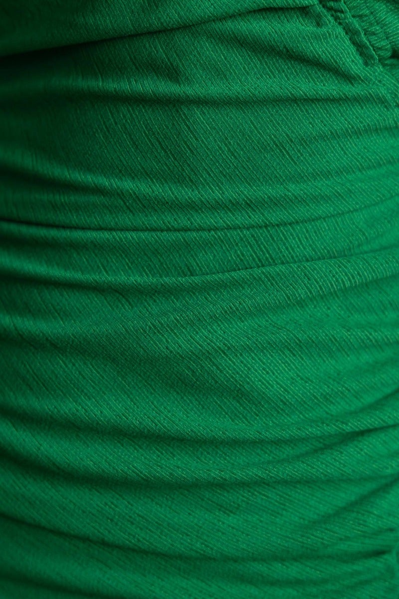 Close-up of the textured green fabric of the Hidden Hills Midi Dress showcasing the ruching detail.