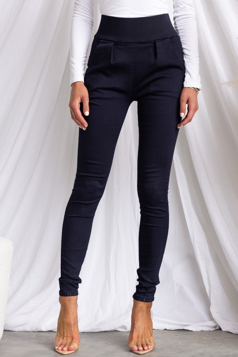 Navy high-waisted pants with front pockets and zip back, featuring a super tight fit on a model.