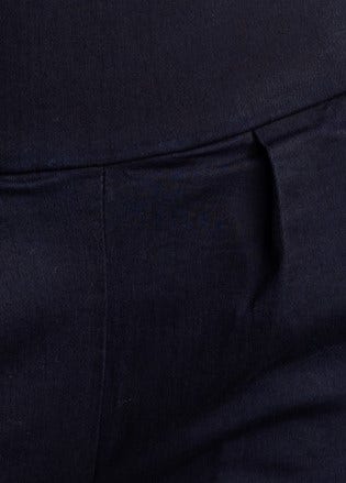 Navy high-mid waist pants with front pockets and faux back pockets, featuring a zip closure and stretch material.
