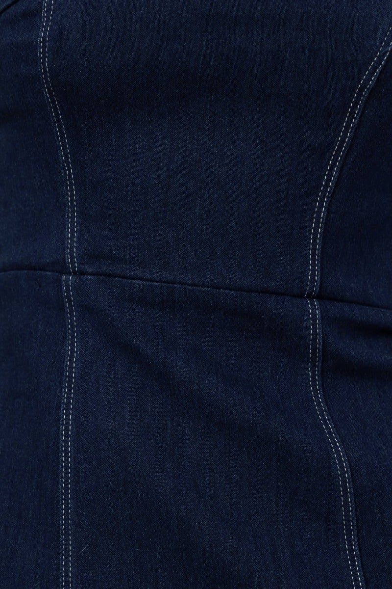 Close-up of navy denim fabric detailing of the Dalian Denim Maxi Dress, highlighting the seams and material texture.