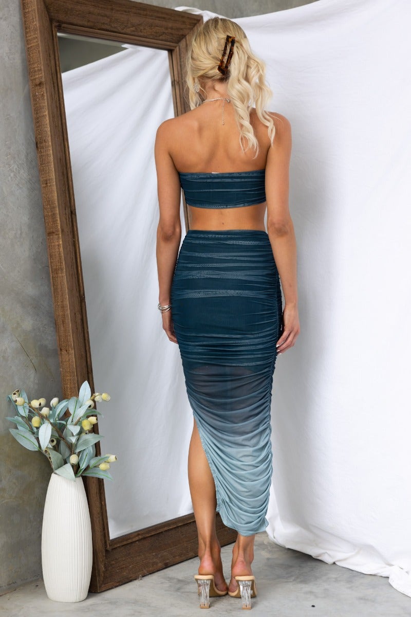 Back view of the Heart On Fire Maxi Dress featuring a strapless design and ruched detailing.