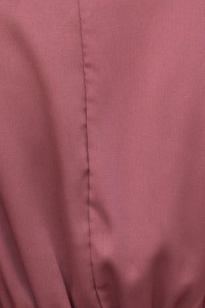 Close-up of Xention Dress fabric in soft mauve hue, showcasing smooth satin texture and elegant finish.