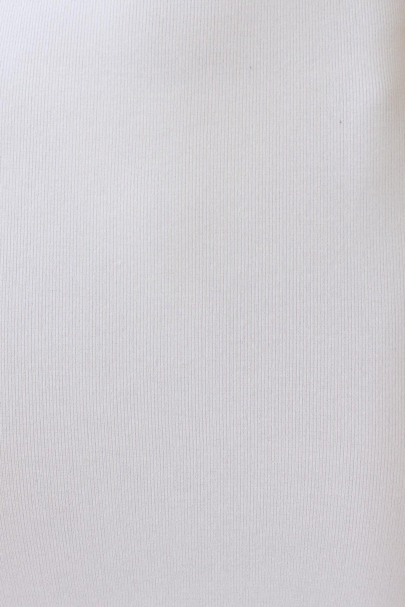 Close-up of ribbed knit fabric in white, showcasing its smooth texture and stretch for the Dwyn Midi Dress.
