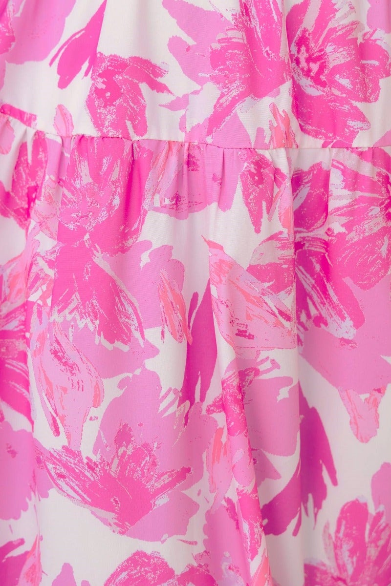 Close-up of vibrant pink floral print fabric on the Bursa Maxi Dress, showcasing beautiful color details.