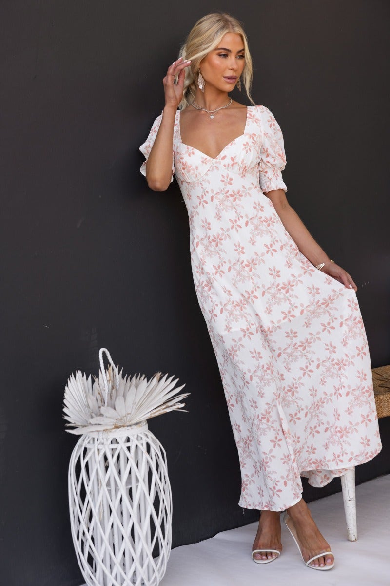 Floral print Have A Moment maxi dress with elastic cuffs and open back, styled with a chic white basket.