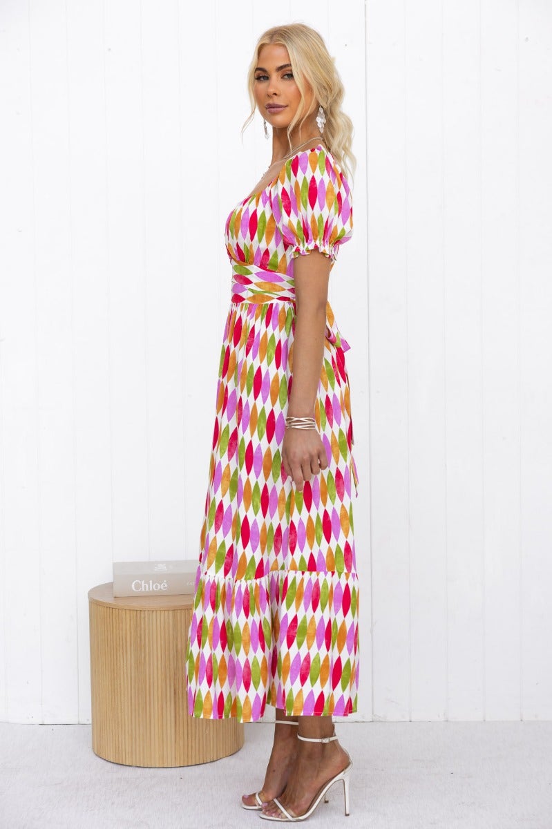 Model wearing a multi-colour print garland midi dress with sweetheart neckline and elastic sleeves.