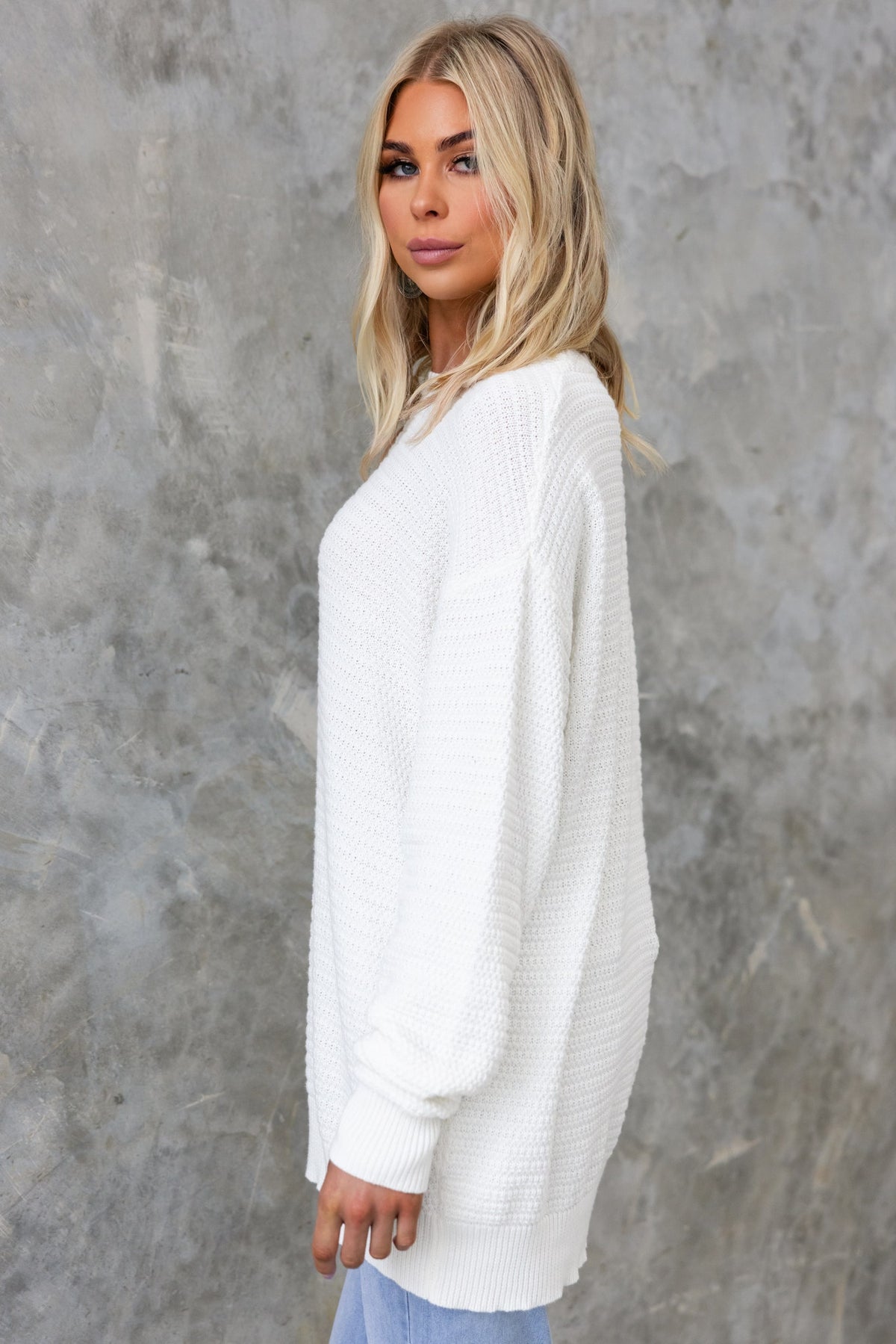 Rhode Jumper in white, featuring a relaxed fit, round neckline and made from stretchy knit cotton fabric.
