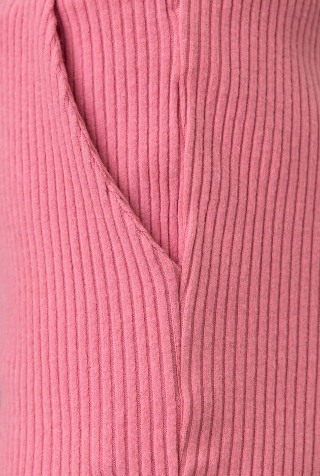 Close-up of ribbed pink Mehki Top showcasing its elastic sleeves and soft material texture.