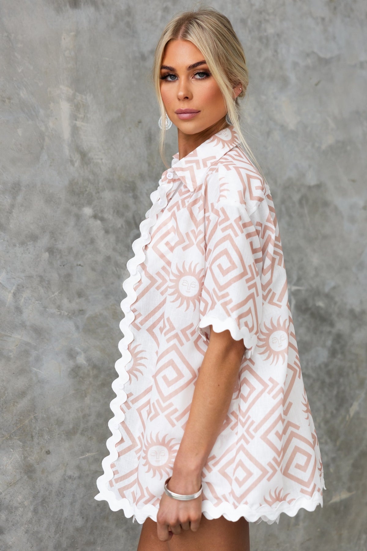 Model wearing a Take It Easy Shirt with a geometric pattern and scalloped edges, featuring a relaxed fit.