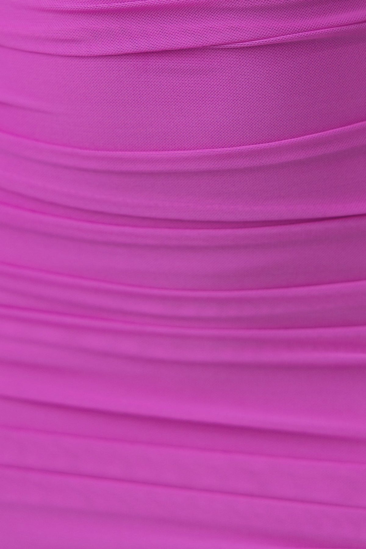 Close-up of the Athia Dress in vibrant pink fabric with gathered texture, showcasing its elegant design details.