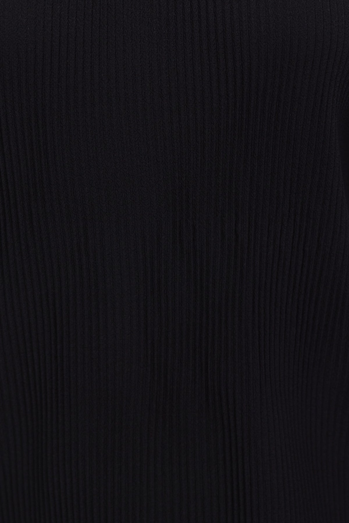 Close-up of the ribbed fabric of the Barbara Top in black, showcasing high neckline and stretch material.
