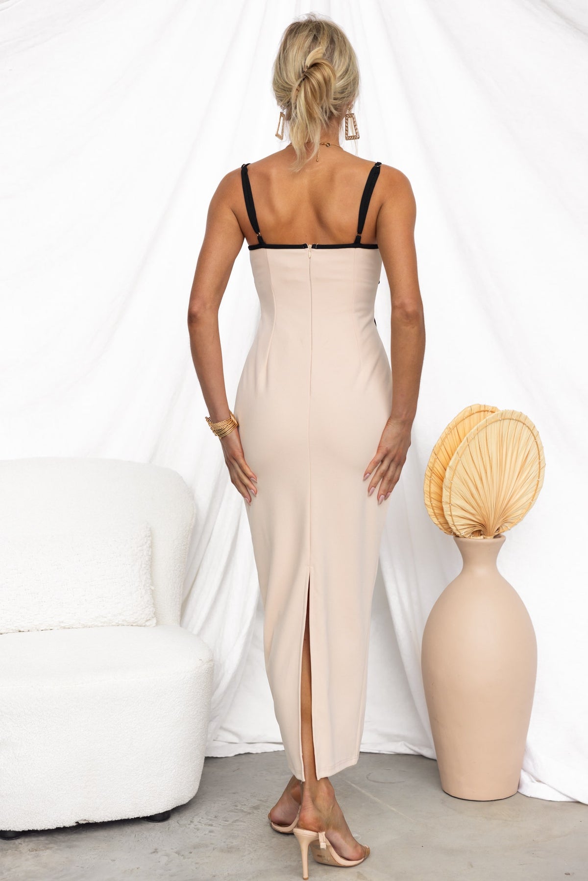 Back view of Nabila Maxi Dress showing adjustable straps, invisible zip, and stylish back split.