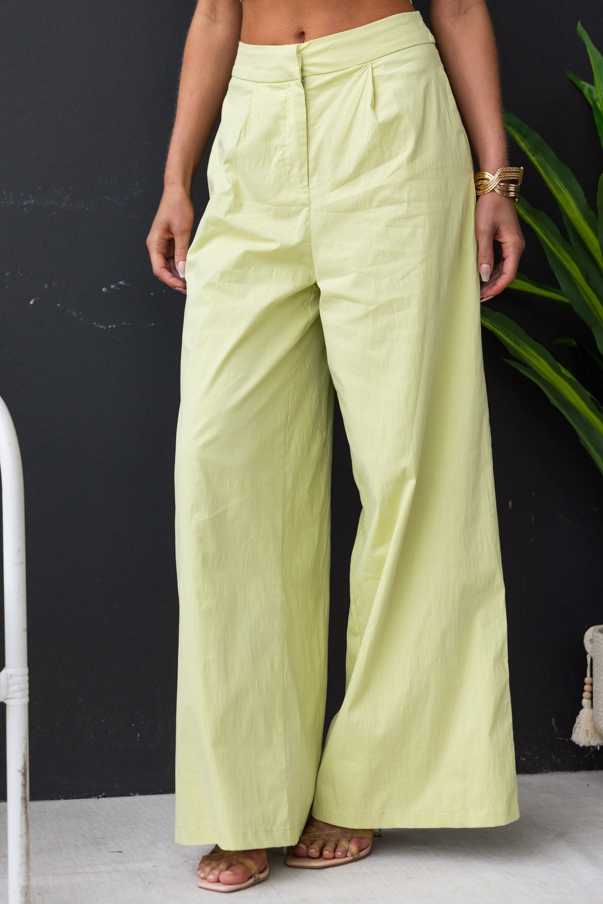 Light green Janae Pants with high waist fit and pockets, perfect for a stylish and comfortable look.