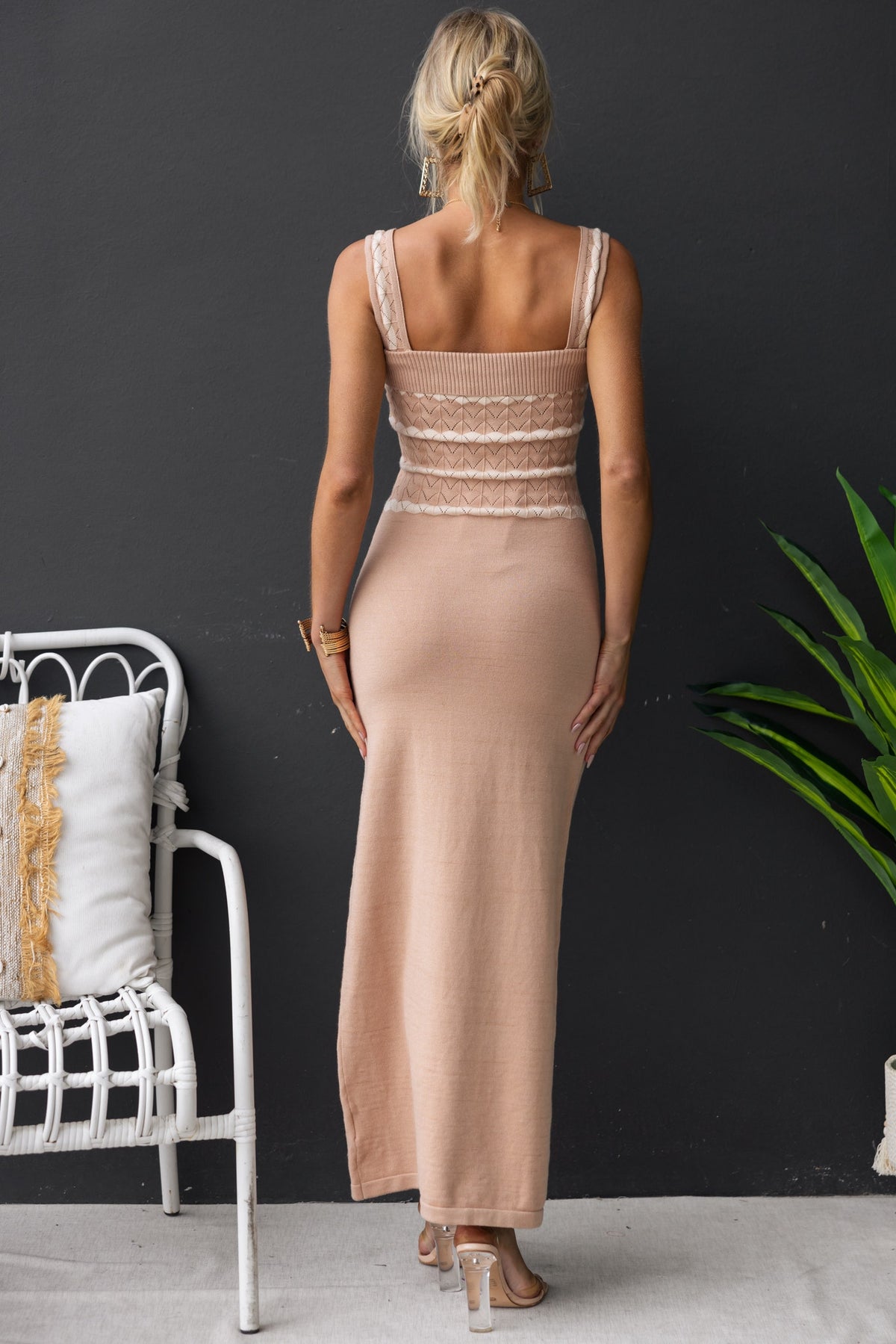 Back view of a woman in a Tarnya maxi dress featuring knit material and fitted design, perfect for summer outings.