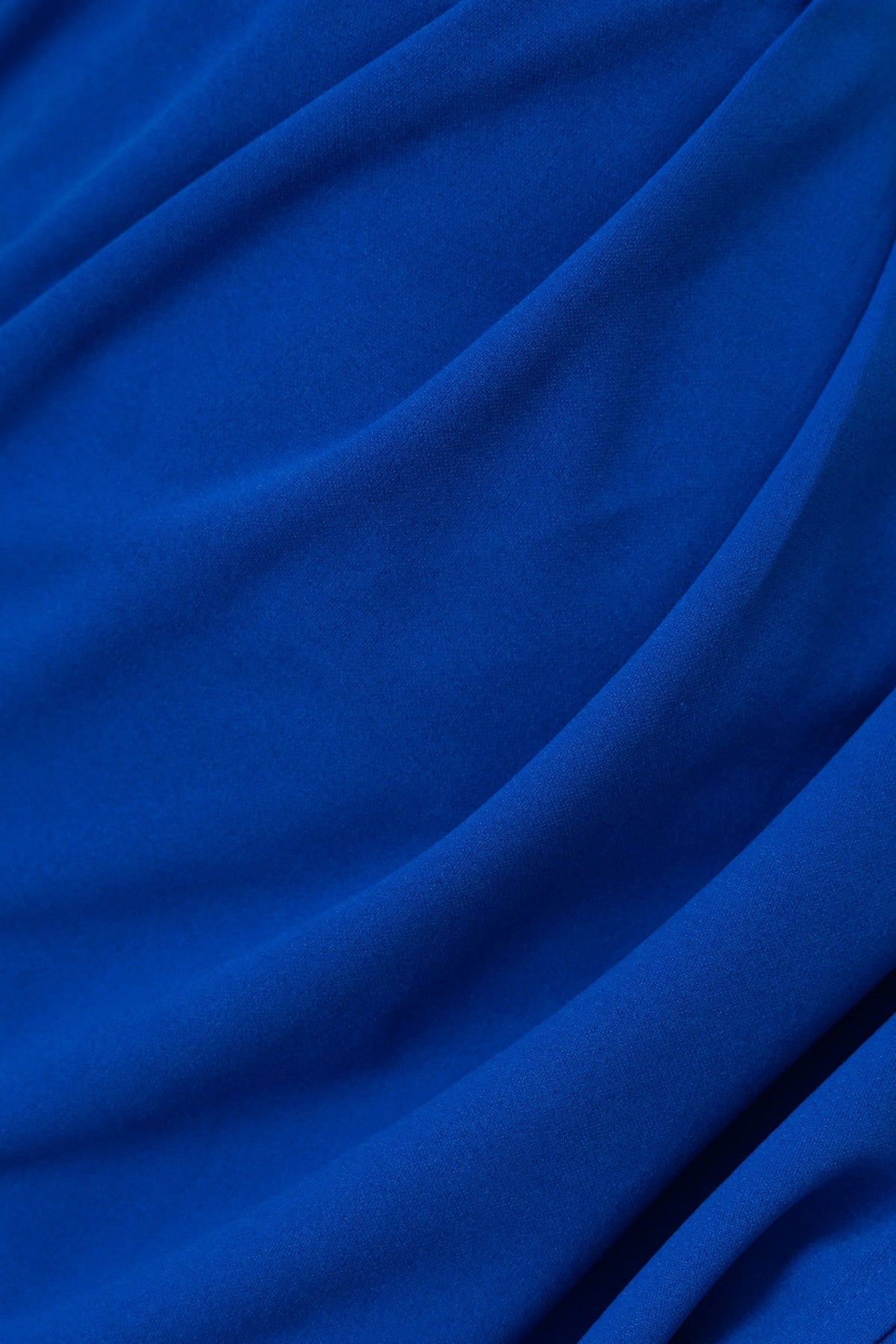 Close-up of rich blue fabric draping, highlighting texture and quality for the Abena Midi Dress.