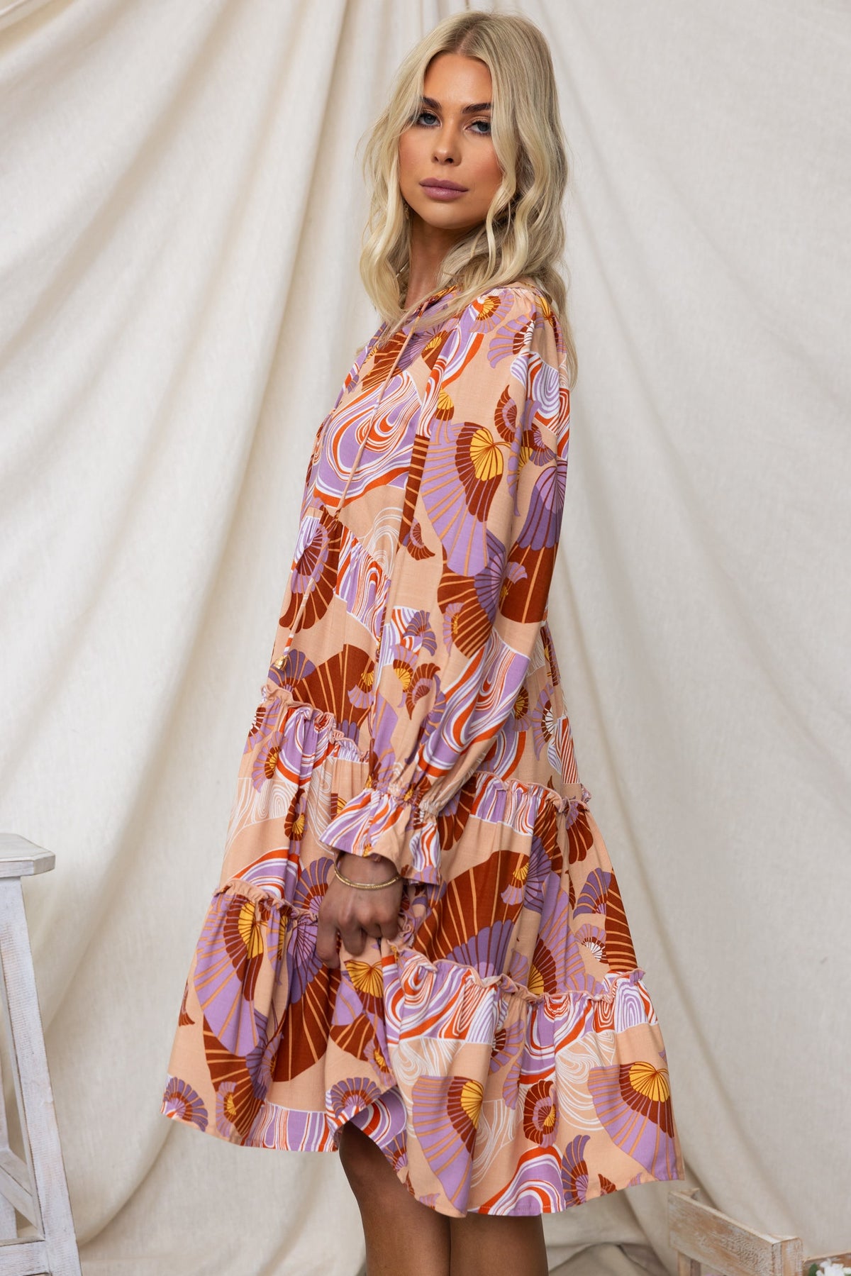 Boone Dress featuring vibrant patterns, V-neckline, and relaxed fit, perfect for casual outings.