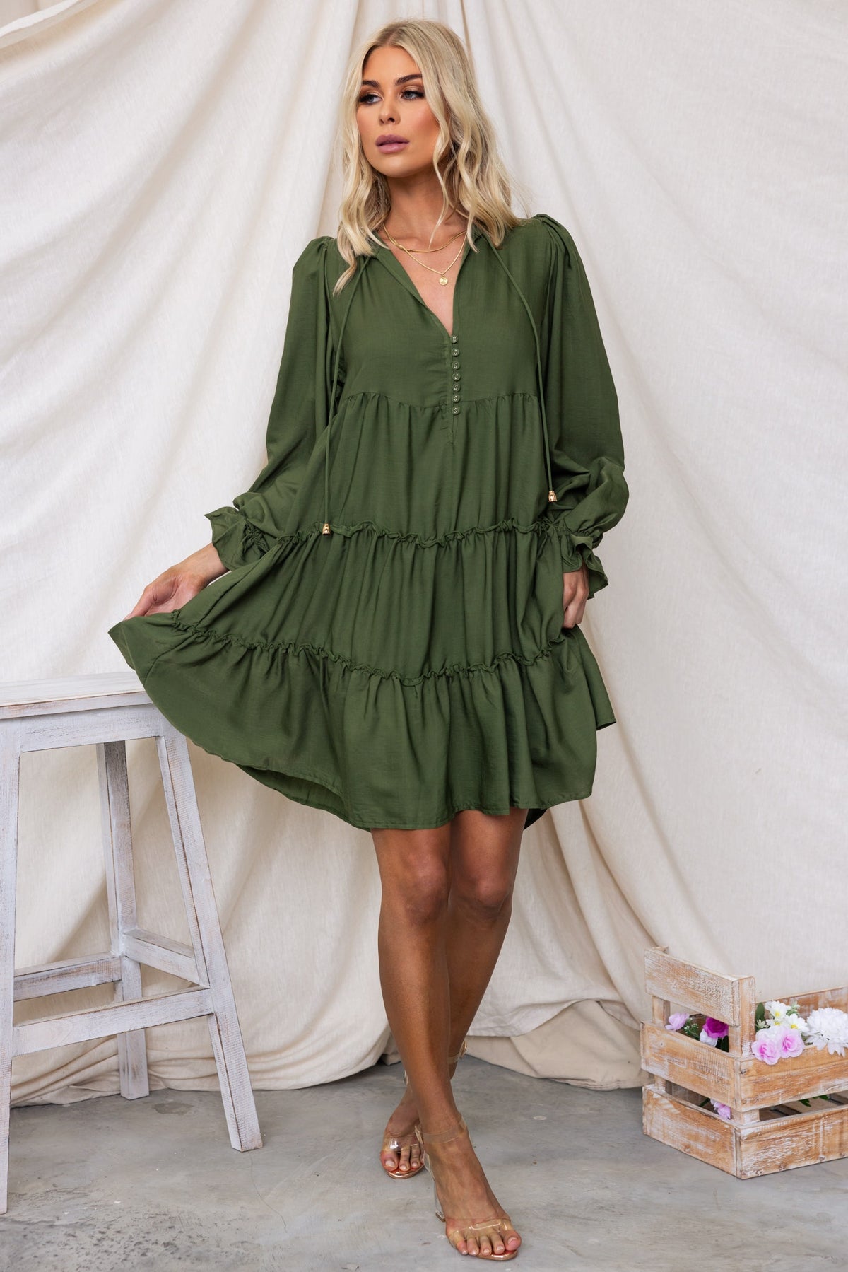 Boone Dress in olive green with V-neckline, button-up front, and tiered skirt, perfect for casual wear.