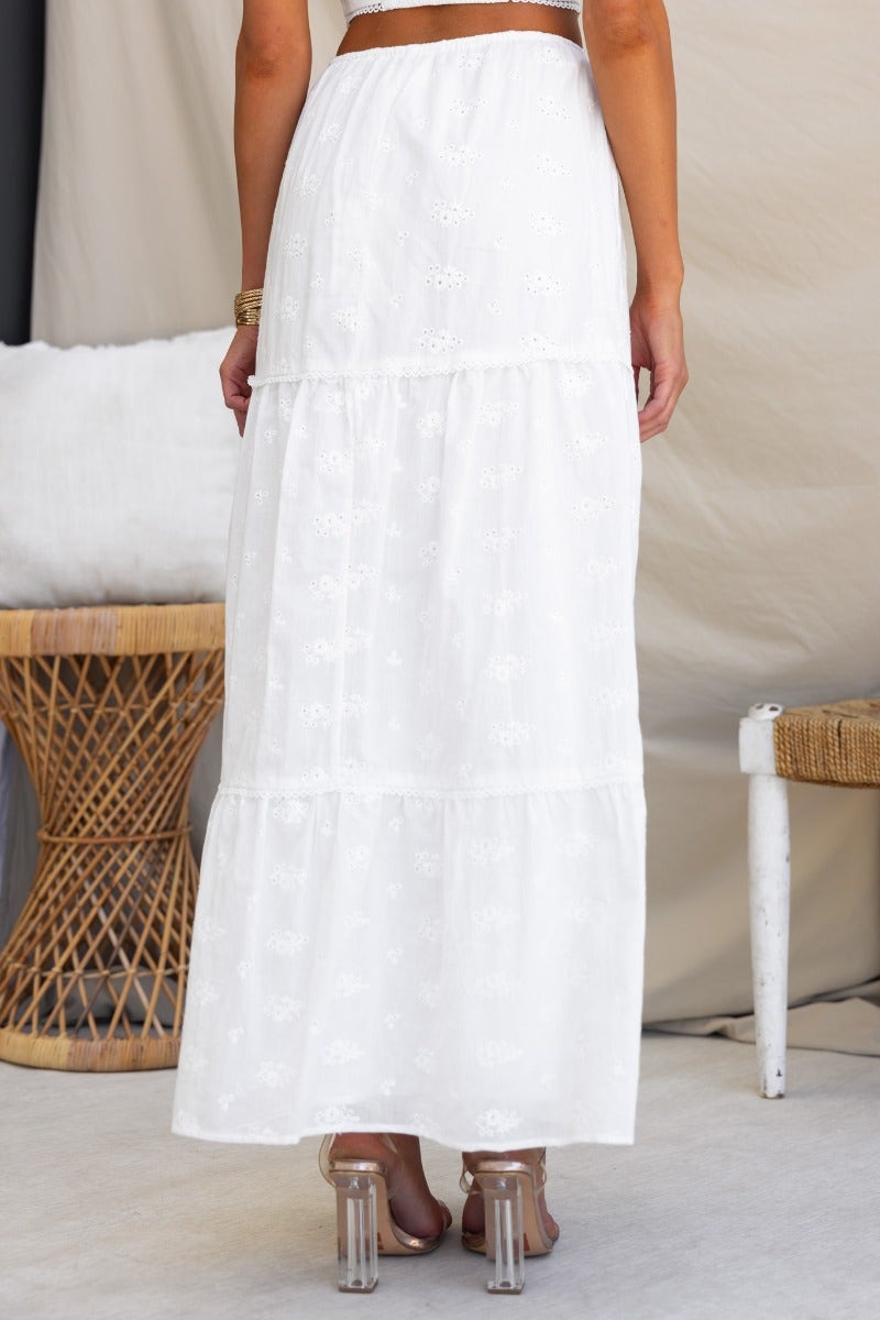 Back view of Long Live Maxi Skirt in white Anglaise material with elastic waistband and drawstring.