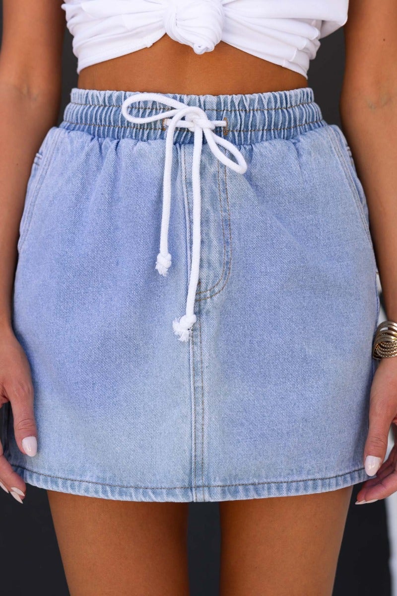 Serona Denim Skirt featuring an elastic waistband and drawstring, perfect for a casual summer look.