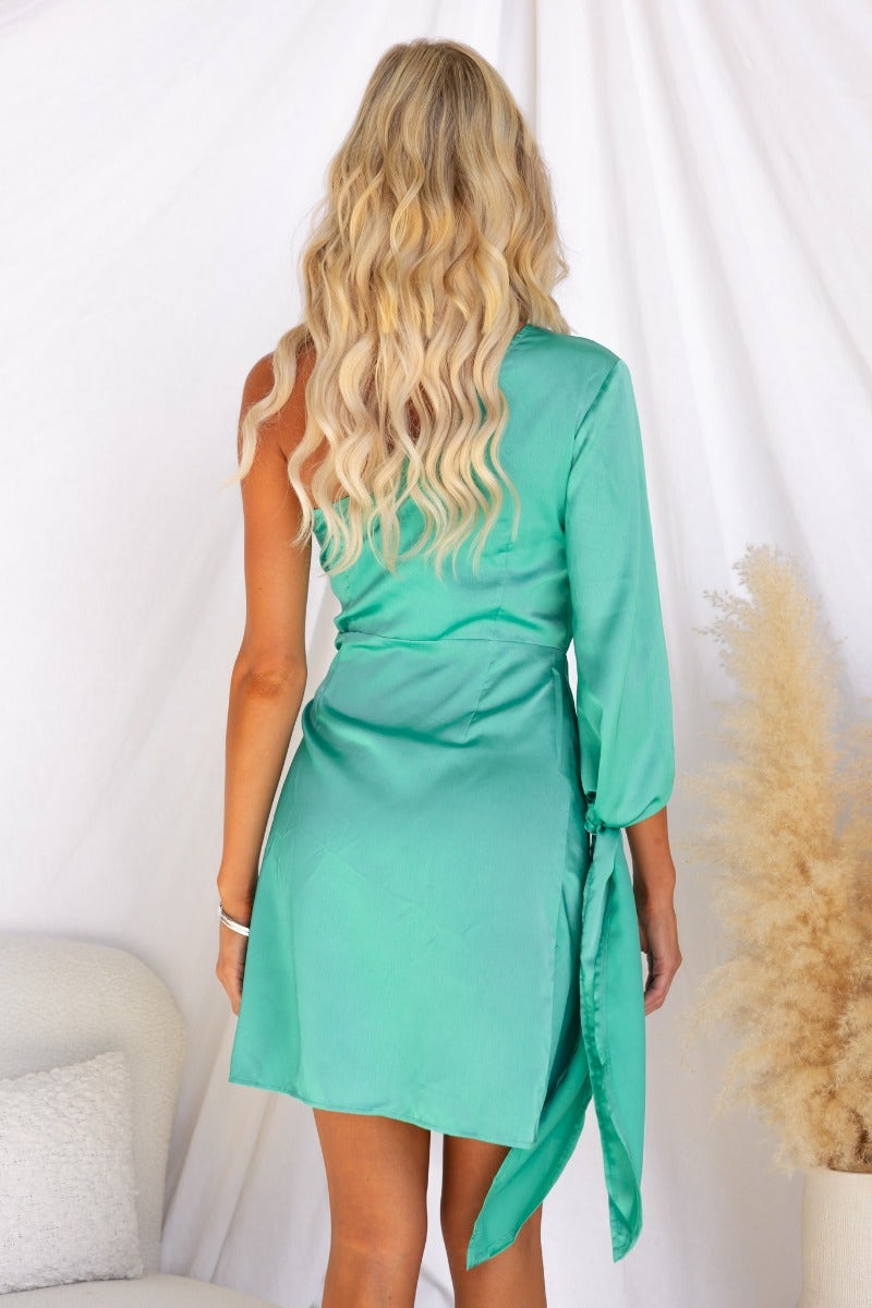 Back view of the Sparks Fly Dress in satin with a one-shoulder neckline and side tie detail.