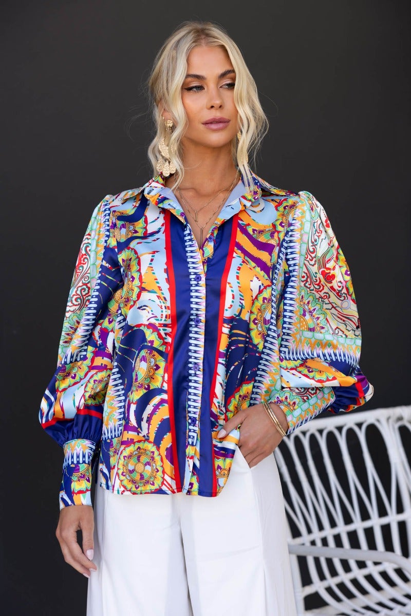 Stylish Indianna Shirt featuring colorful print and satin finish with a button-up front and relaxed fit on model.