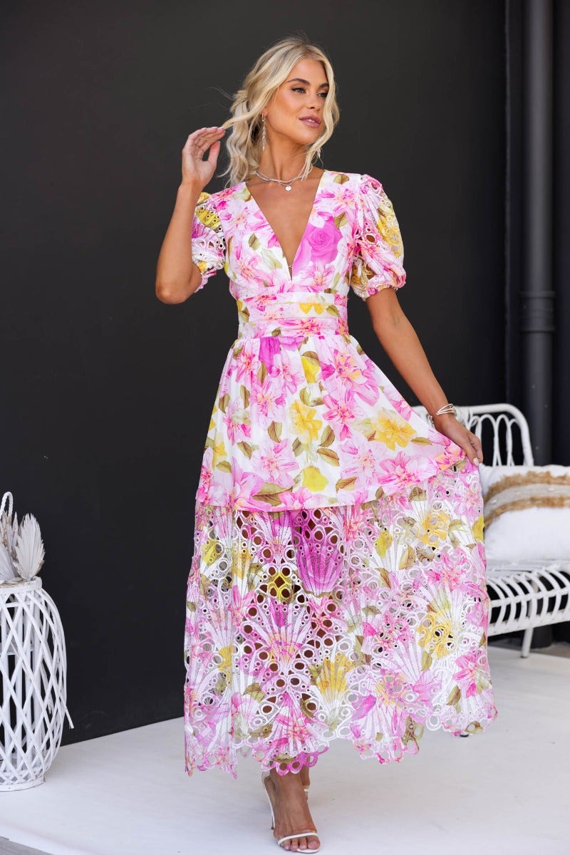 Floral print Forever Free maxi dress with V-neckline, elastic sleeves, and lace trim, worn by model outdoors.
