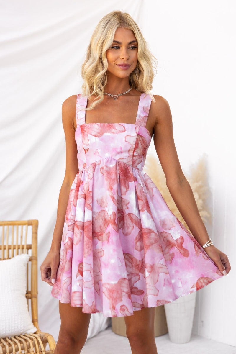 Cheerful cotton blend dress with square neckline and playful pink floral pattern, perfect for warm weather styling.